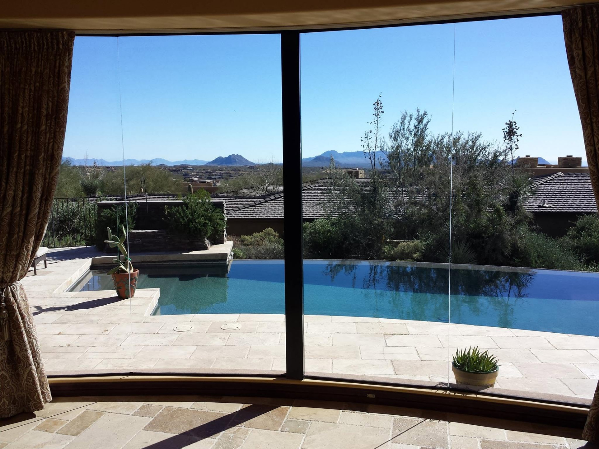 Spotless picture window overlooking a pool in Scottsdale, Arizona