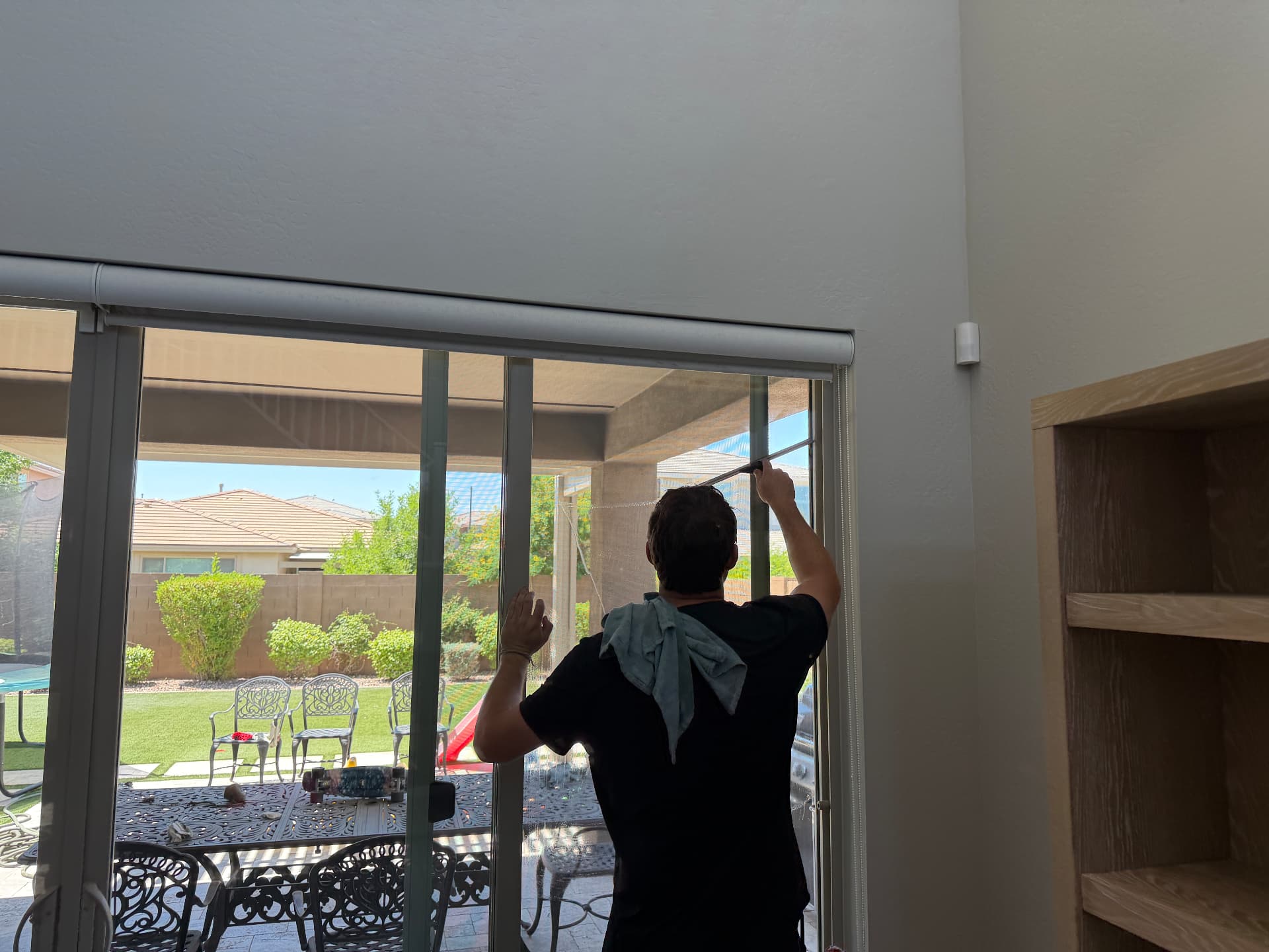Cleaning interior sliding glass doors in a Phoenix, Arizona home